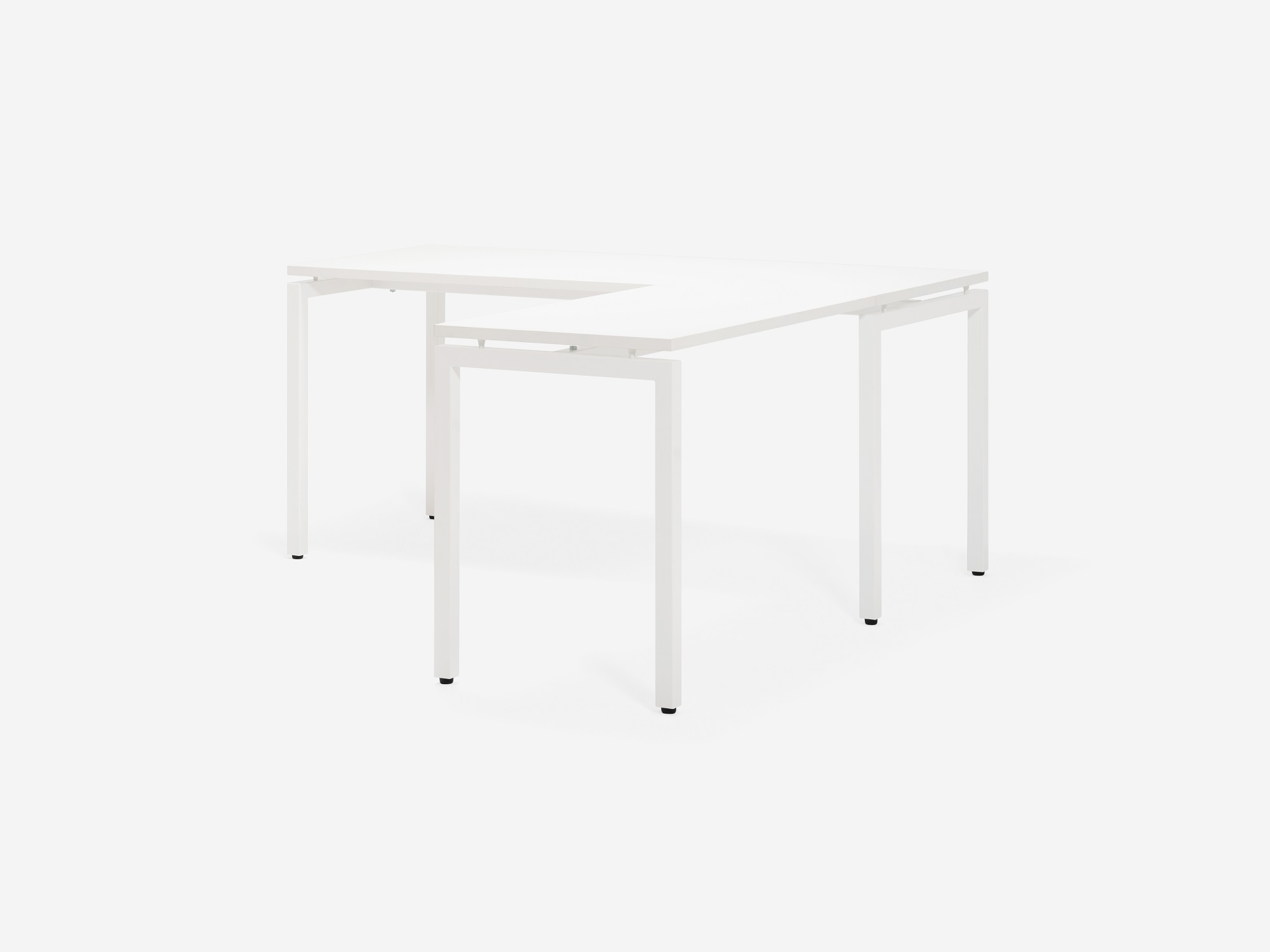 Angled view of the Novah right hand custom desk with white top and white base